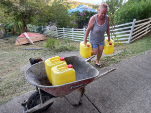 Carrying water in a wheelbarrow