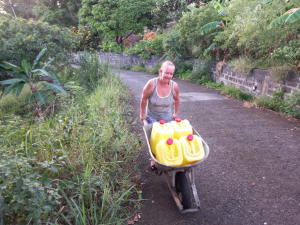 Carrying water in a wheelbarrow